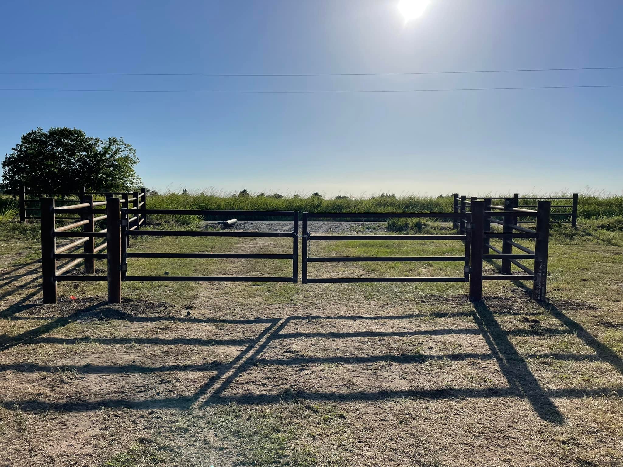 Pipe fencing along an Oklahoma driveway — F'Amos Fencing & Construction
